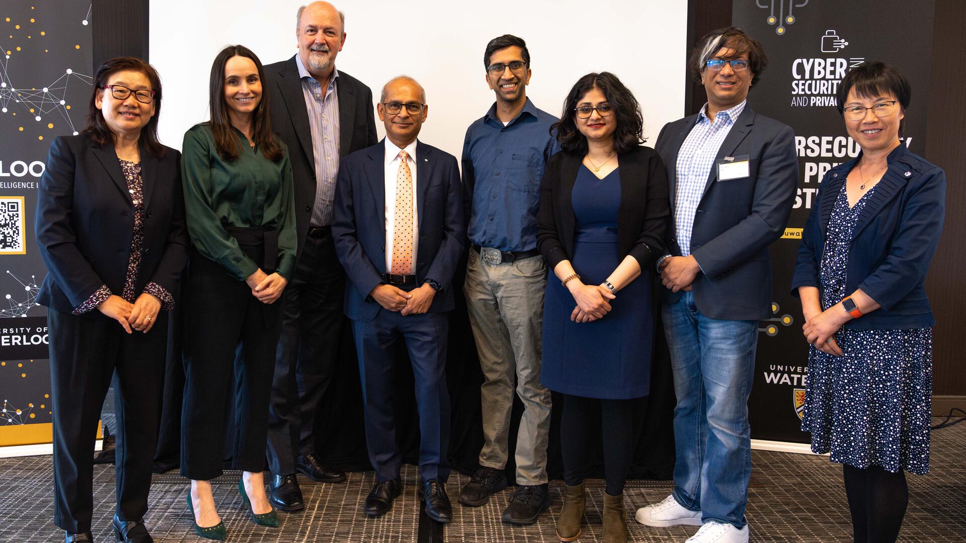 A group of 8 researchers posing for a picture