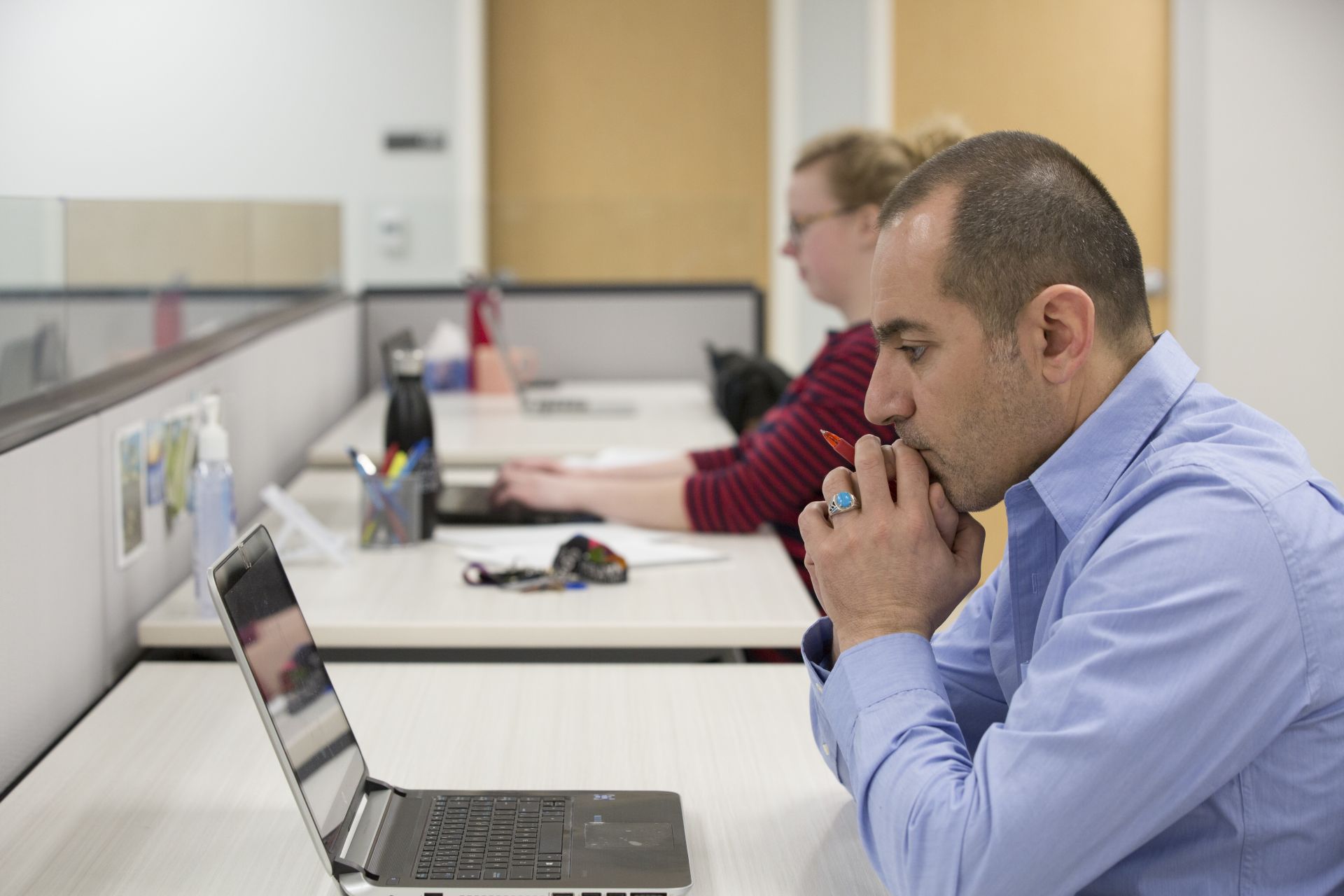 two students working at computers in classroom